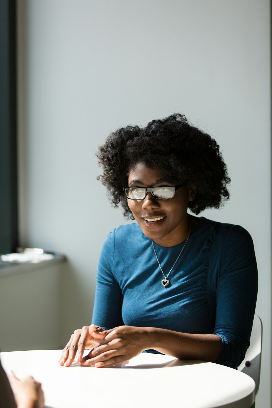 person speaking confidently in meeting