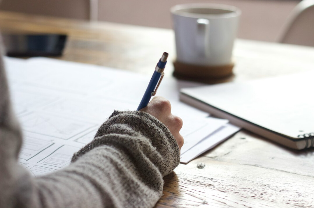 person setting goals on paper