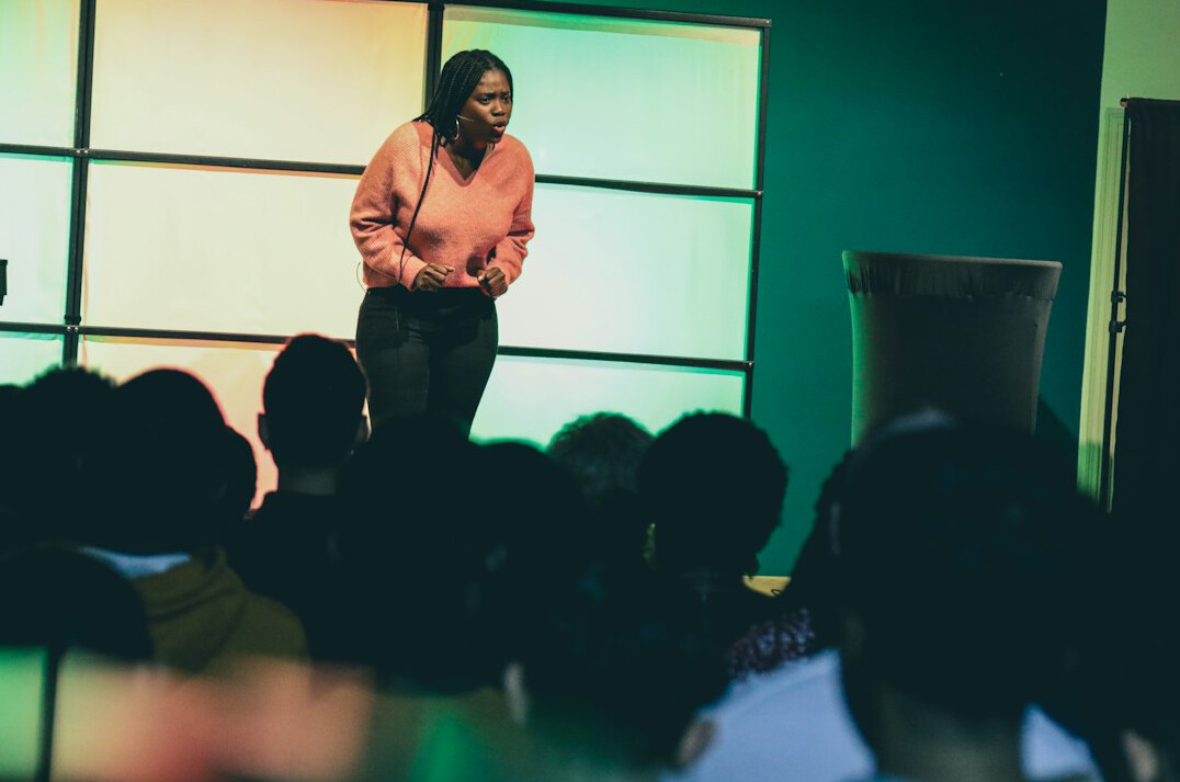 person speaking confidently in meeting