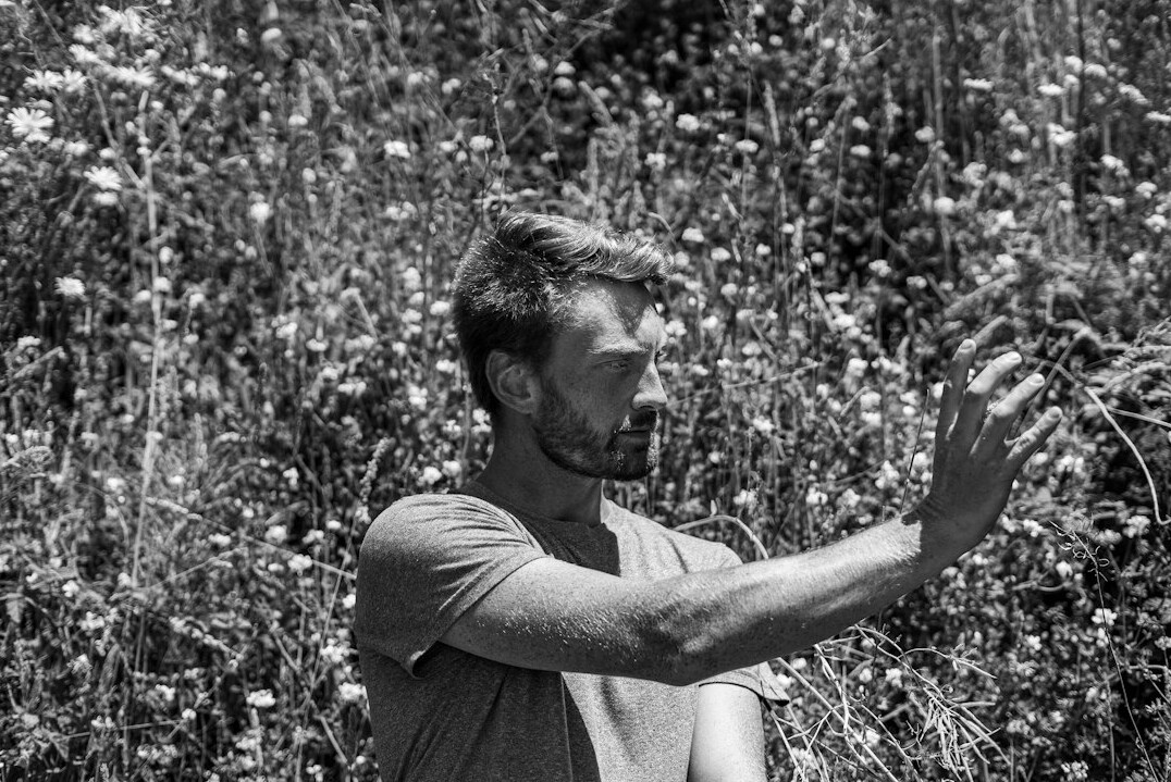 man meditating outdoors